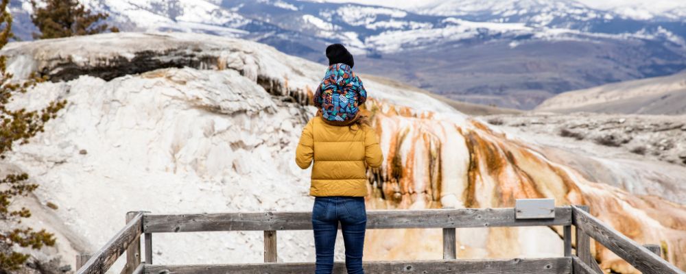 child and parent overlooking national park